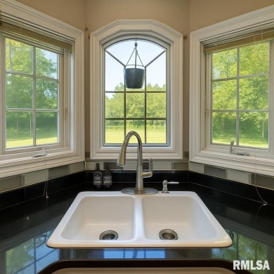 Located on a spacious corner lot just steps from the driving on WeaverRidge Golf Club in Illinois - for sale on GolfHomes.com, golf home, golf lot