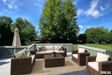 Located on a spacious corner lot just steps from the driving on WeaverRidge Golf Club in Illinois - for sale on GolfHomes.com, golf home, golf lot