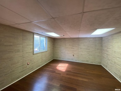 Located on a spacious corner lot just steps from the driving on WeaverRidge Golf Club in Illinois - for sale on GolfHomes.com, golf home, golf lot