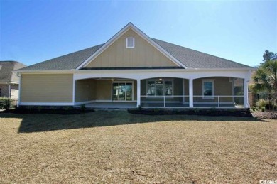 This brand-new custom home boasts 5 spacious bedrooms and 4 on Wild Wing Plantation in South Carolina - for sale on GolfHomes.com, golf home, golf lot