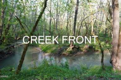 ENGLISH CREEK FRONTAGE within Walking or Golf cart distance to on Smoky Mountain Country Club in Tennessee - for sale on GolfHomes.com, golf home, golf lot