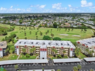 This updated condo features a spacious living area with an on Boca Dunes Golf and Country Club in Florida - for sale on GolfHomes.com, golf home, golf lot