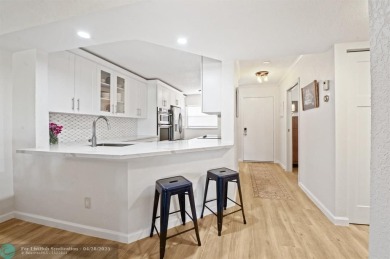 This updated condo features a spacious living area with an on Boca Dunes Golf and Country Club in Florida - for sale on GolfHomes.com, golf home, golf lot