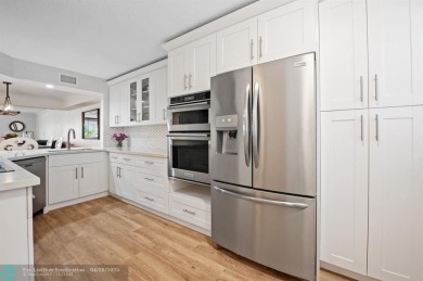 This updated condo features a spacious living area with an on Boca Dunes Golf and Country Club in Florida - for sale on GolfHomes.com, golf home, golf lot