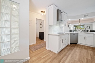 This updated condo features a spacious living area with an on Boca Dunes Golf and Country Club in Florida - for sale on GolfHomes.com, golf home, golf lot