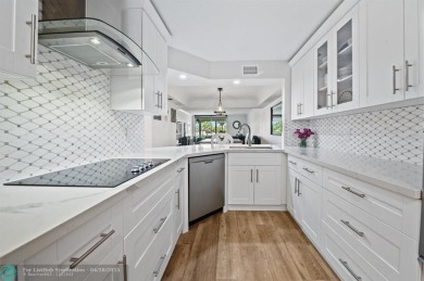 This updated condo features a spacious living area with an on Boca Dunes Golf and Country Club in Florida - for sale on GolfHomes.com, golf home, golf lot