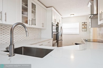 This updated condo features a spacious living area with an on Boca Dunes Golf and Country Club in Florida - for sale on GolfHomes.com, golf home, golf lot