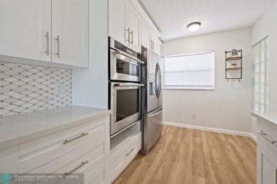 This updated condo features a spacious living area with an on Boca Dunes Golf and Country Club in Florida - for sale on GolfHomes.com, golf home, golf lot