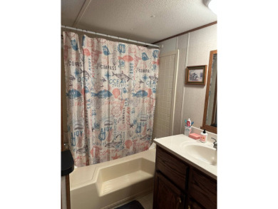 Kentucky Lake area 2bedroom/1bath fully furnished mobile home on Tennessean Golf Club in Tennessee - for sale on GolfHomes.com, golf home, golf lot