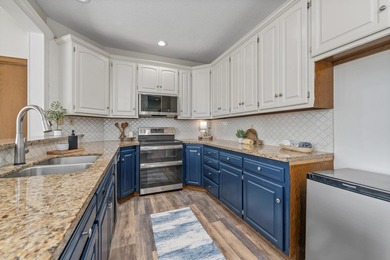 Luxury golf course living with front-row views of Hole 6 this is on Tallgrass Country Club in Kansas - for sale on GolfHomes.com, golf home, golf lot