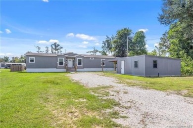 Step into luxury with this stunning custom-built manufactured on The National Golf Club of Louisiana in Louisiana - for sale on GolfHomes.com, golf home, golf lot