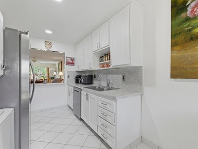 Beautifully updated villa in Palm Greens 55+ community. Home on Villa Del Ray Golf Club in Florida - for sale on GolfHomes.com, golf home, golf lot