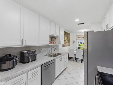 Beautifully updated villa in Palm Greens 55+ community. Home on Villa Del Ray Golf Club in Florida - for sale on GolfHomes.com, golf home, golf lot