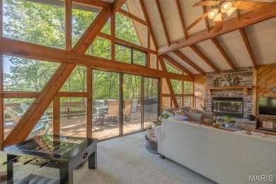Escape to your own lakeside paradise at this super cute chalet on Innsbrook Resort Golf Course in Missouri - for sale on GolfHomes.com, golf home, golf lot