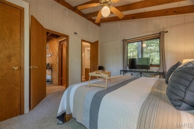 Escape to your own lakeside paradise at this super cute chalet on Innsbrook Resort Golf Course in Missouri - for sale on GolfHomes.com, golf home, golf lot