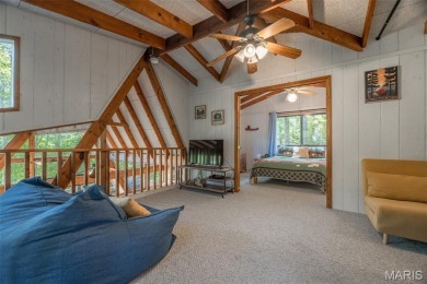 Escape to your own lakeside paradise at this super cute chalet on Innsbrook Resort Golf Course in Missouri - for sale on GolfHomes.com, golf home, golf lot