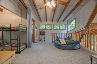 Escape to your own lakeside paradise at this super cute chalet on Innsbrook Resort Golf Course in Missouri - for sale on GolfHomes.com, golf home, golf lot