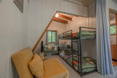 Escape to your own lakeside paradise at this super cute chalet on Innsbrook Resort Golf Course in Missouri - for sale on GolfHomes.com, golf home, golf lot