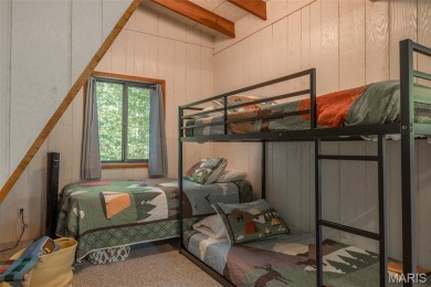 Escape to your own lakeside paradise at this super cute chalet on Innsbrook Resort Golf Course in Missouri - for sale on GolfHomes.com, golf home, golf lot