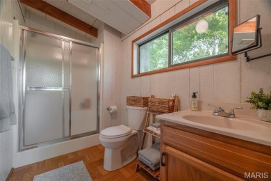 Escape to your own lakeside paradise at this super cute chalet on Innsbrook Resort Golf Course in Missouri - for sale on GolfHomes.com, golf home, golf lot