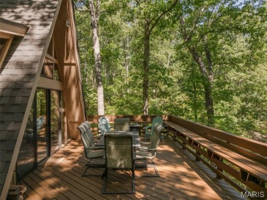 Escape to your own lakeside paradise at this super cute chalet on Innsbrook Resort Golf Course in Missouri - for sale on GolfHomes.com, golf home, golf lot