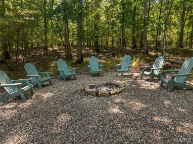 Escape to your own lakeside paradise at this super cute chalet on Innsbrook Resort Golf Course in Missouri - for sale on GolfHomes.com, golf home, golf lot