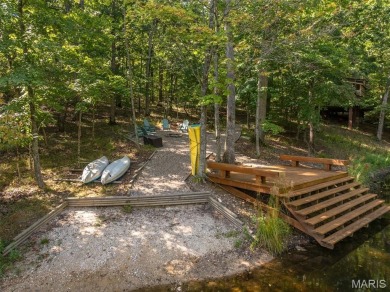 Escape to your own lakeside paradise at this super cute chalet on Innsbrook Resort Golf Course in Missouri - for sale on GolfHomes.com, golf home, golf lot