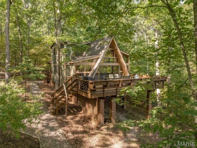 Escape to your own lakeside paradise at this super cute chalet on Innsbrook Resort Golf Course in Missouri - for sale on GolfHomes.com, golf home, golf lot