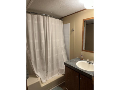 Located on a corner lot in Pine Point, this 2 bedroom, 1.5 bath on Tennessean Golf Club in Tennessee - for sale on GolfHomes.com, golf home, golf lot