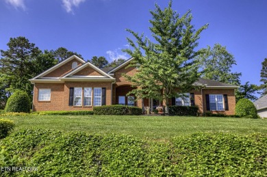 This custom all brick home in the heart of Tellico Village is on Tanasi Golf Course in Tennessee - for sale on GolfHomes.com, golf home, golf lot