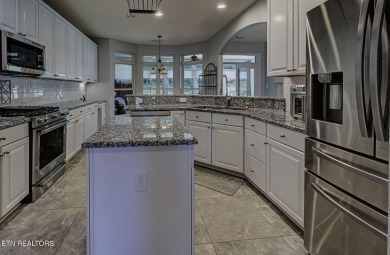 This custom all brick home in the heart of Tellico Village is on Tanasi Golf Course in Tennessee - for sale on GolfHomes.com, golf home, golf lot