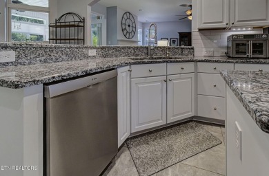 This custom all brick home in the heart of Tellico Village is on Tanasi Golf Course in Tennessee - for sale on GolfHomes.com, golf home, golf lot