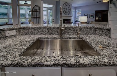 This custom all brick home in the heart of Tellico Village is on Tanasi Golf Course in Tennessee - for sale on GolfHomes.com, golf home, golf lot