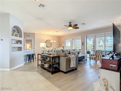 Expanded IBIS II pool home with serene lake and fountain views on Herons Glen Golf and Country Club in Florida - for sale on GolfHomes.com, golf home, golf lot