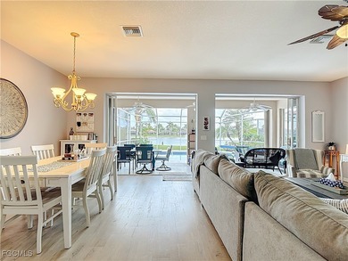 Expanded IBIS II pool home with serene lake and fountain views on Herons Glen Golf and Country Club in Florida - for sale on GolfHomes.com, golf home, golf lot