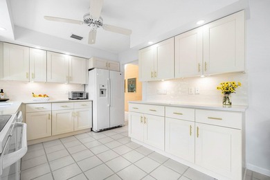 Completely charming villa w/ picturesque lake views! Live on Hunters Run Golf and Country Club in Florida - for sale on GolfHomes.com, golf home, golf lot