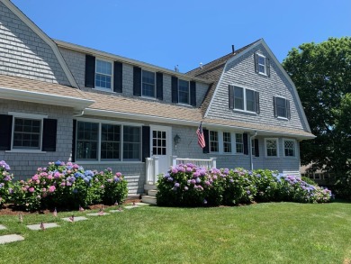 Enjoy the summer breezes and views of the harbor from the porch on Hyannisport Club in Massachusetts - for sale on GolfHomes.com, golf home, golf lot