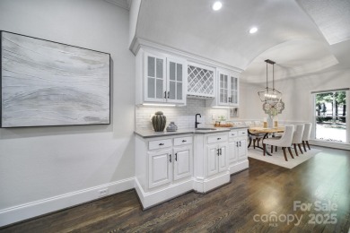 Ideally situated on a picturesque 1-acre lot in Lake Norman's on Trump National Golf Club Charlotte in North Carolina - for sale on GolfHomes.com, golf home, golf lot
