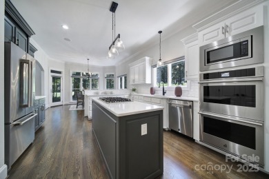 Ideally situated on a picturesque 1-acre lot in Lake Norman's on Trump National Golf Club Charlotte in North Carolina - for sale on GolfHomes.com, golf home, golf lot