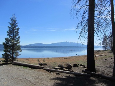 This property is .90 acres sloping towards beautiful Goose bay on Lake Almanor West Golf Course in California - for sale on GolfHomes.com, golf home, golf lot