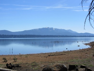 This property is .90 acres sloping towards beautiful Goose bay on Lake Almanor West Golf Course in California - for sale on GolfHomes.com, golf home, golf lot