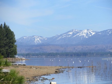 This property is .90 acres sloping towards beautiful Goose bay on Lake Almanor West Golf Course in California - for sale on GolfHomes.com, golf home, golf lot