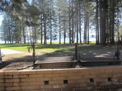 This property is .90 acres sloping towards beautiful Goose bay on Lake Almanor West Golf Course in California - for sale on GolfHomes.com, golf home, golf lot