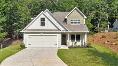 Discover the charm of this nearly new 2023 craftsman-style home on The Highlands Course at Lake Arrowhead in Georgia - for sale on GolfHomes.com, golf home, golf lot