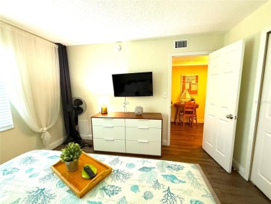 Enjoy the Florida lifestyle in this sunny and upgraded condo on Largo Golf Course in Florida - for sale on GolfHomes.com, golf home, golf lot