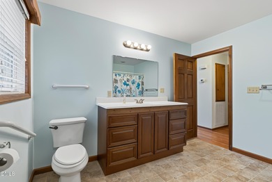 Exceptional Waterfront Retreat in beautiful Lake Royale! This on River Golf and Country Club at Lake Royale in North Carolina - for sale on GolfHomes.com, golf home, golf lot