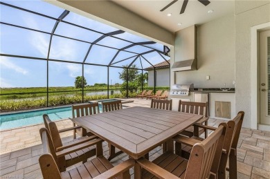 This exquisite *turn key* home, completed in 2022 by Taylor on The Golf Club At Fiddlers Creek in Florida - for sale on GolfHomes.com, golf home, golf lot