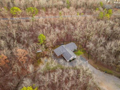 Welcome to your dream home! This 3-4 bedroom house is nestled in on Diamondhead Golf and Country Club in Arkansas - for sale on GolfHomes.com, golf home, golf lot