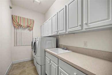 Beautiful Hampton model with concrete block construction located on Eagle Ridge At Spruce Creek Country Club in Florida - for sale on GolfHomes.com, golf home, golf lot