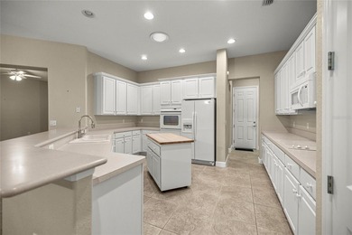 Beautiful Hampton model with concrete block construction located on Eagle Ridge At Spruce Creek Country Club in Florida - for sale on GolfHomes.com, golf home, golf lot